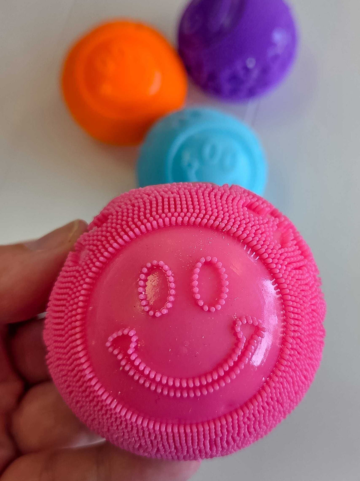 Smiley Fuzz Ball Squishy