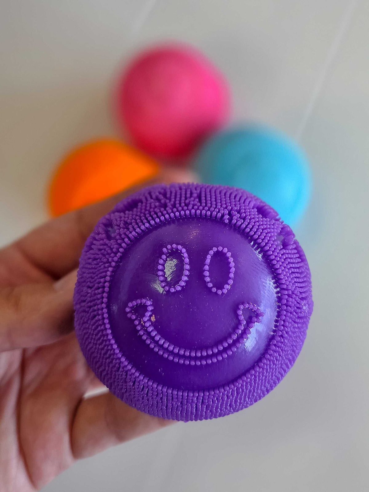 Smiley Fuzz Ball Squishy